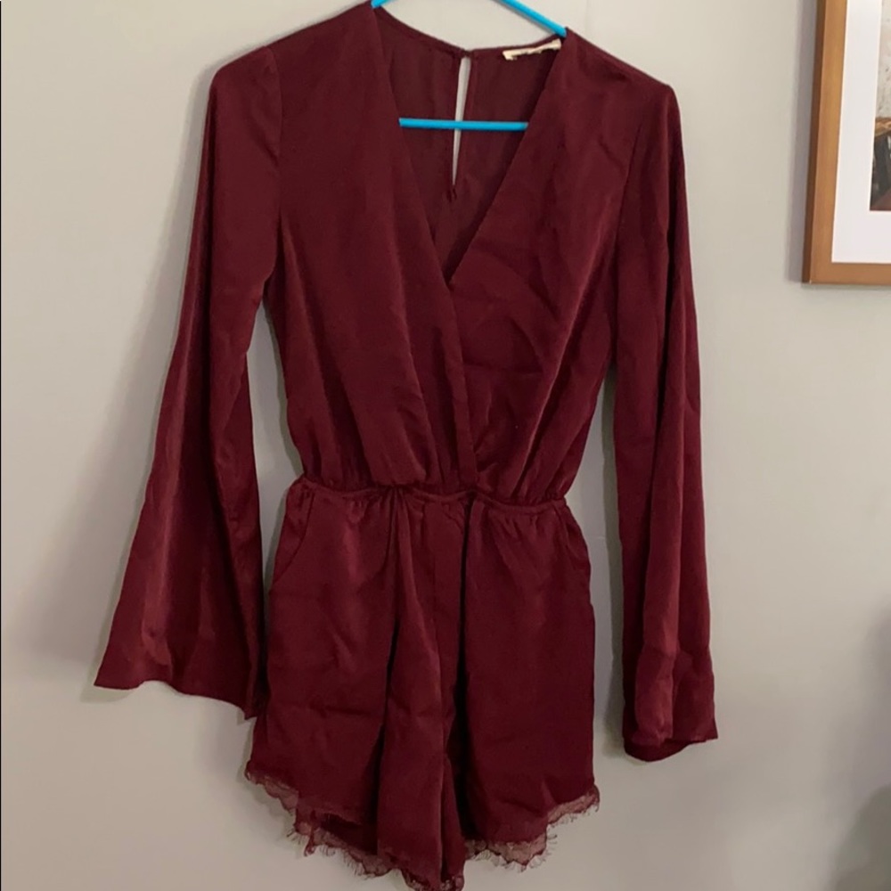 NWOT LONG SLEEVE ROMPER SIZE SMALL